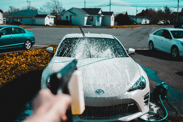 Car washing in a driveway