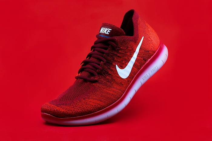 red nike sneaker on red background