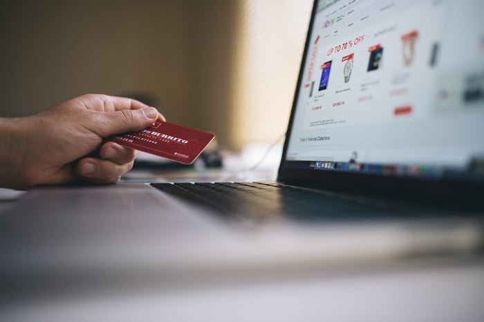 person shopping online with credit card