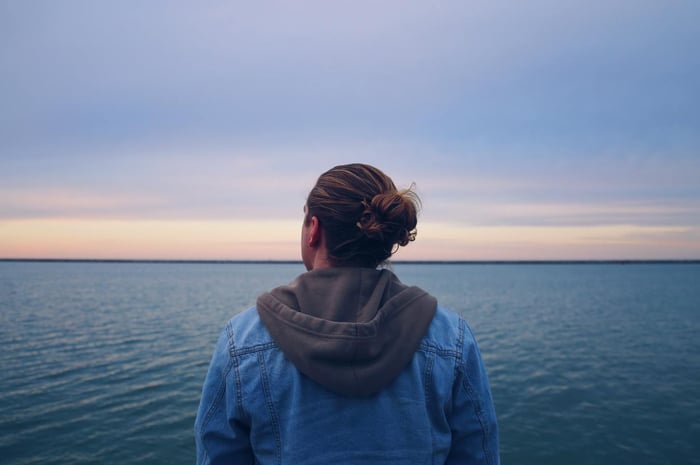 A person looking into the blue horizon