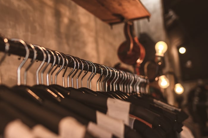 rail of clothes on black hangers