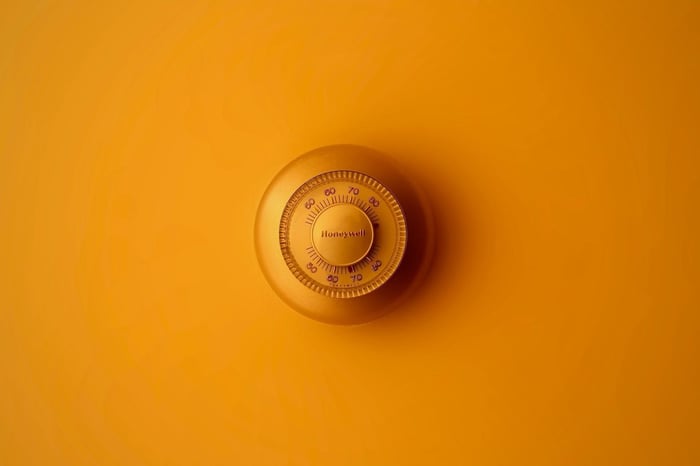 Safe lock against an orange background