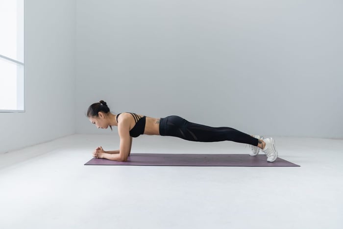 woman planking on exercise mat
