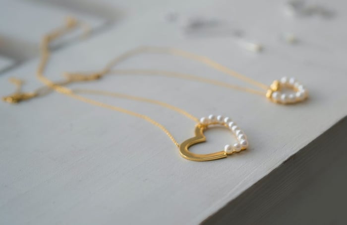 gold and pearl heart shaped necklaces