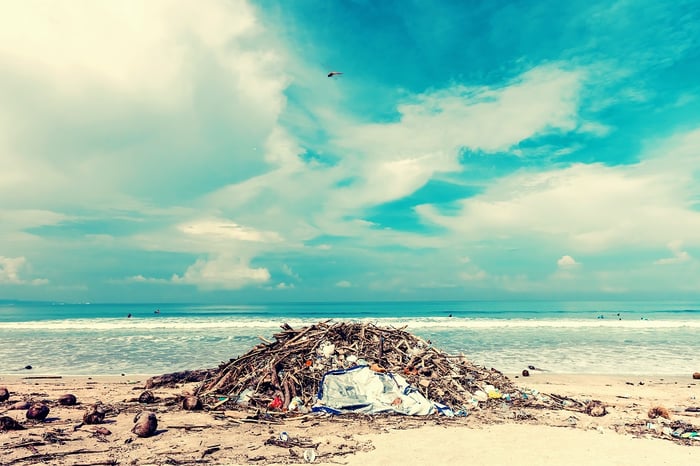 pile of trash on tropical beach