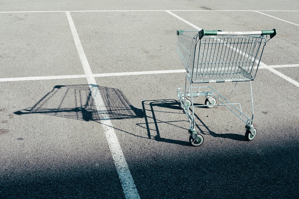 empty shopping cart in parking lot